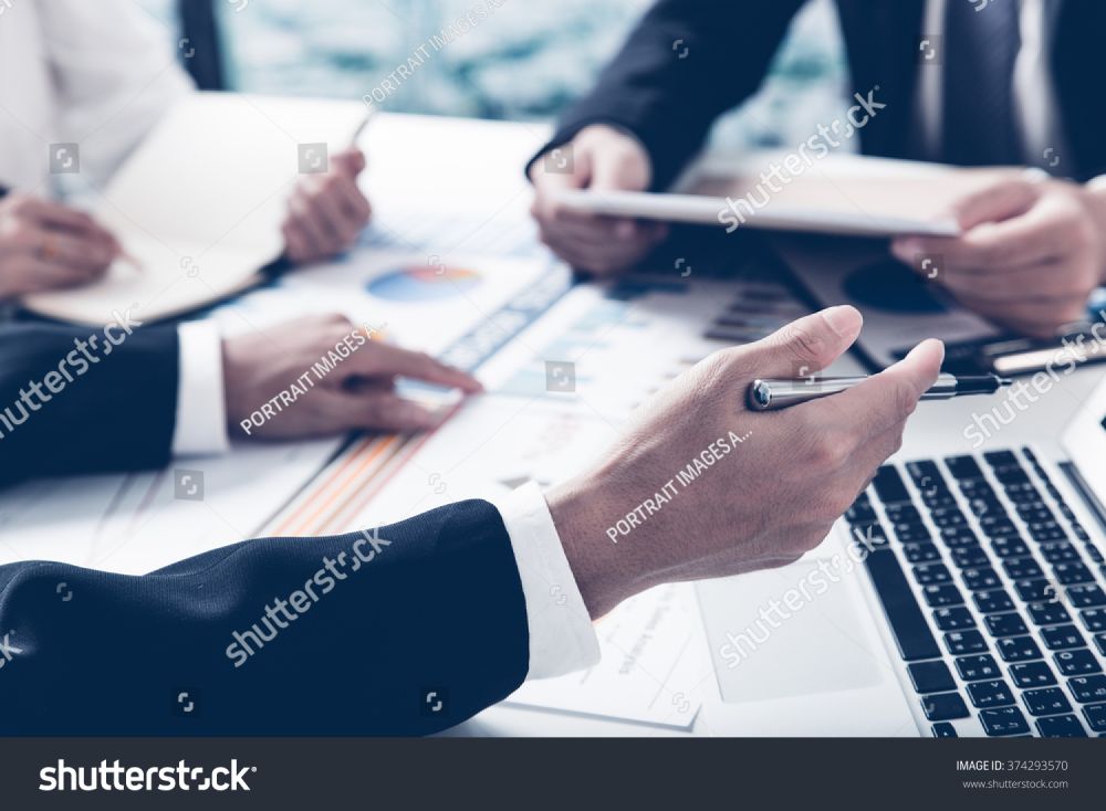 stock-photo-business-adviser-analyzing-financial-figures-denoting-the-progress-in-the-work-of-the-company-374293570.jpg
