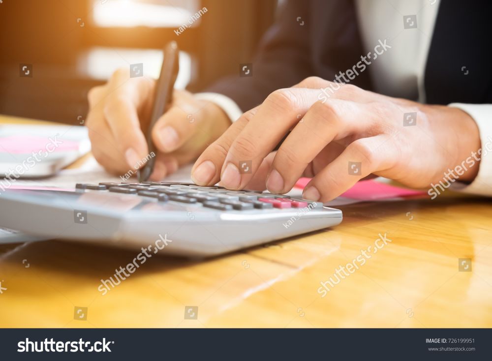stock-photo-close-up-asian-business-woman-using-a-calculator-to-calculate-the-numbers-business-finances-and-726199951.jpg